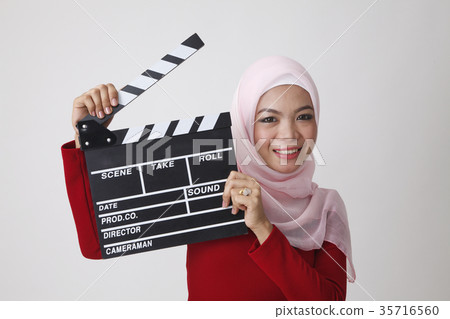 malay woman holding clapper board malay woman holding clapper board 35716560