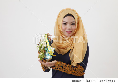 woman with ribbon ketupat woman with ribbon ketupat 35716643
