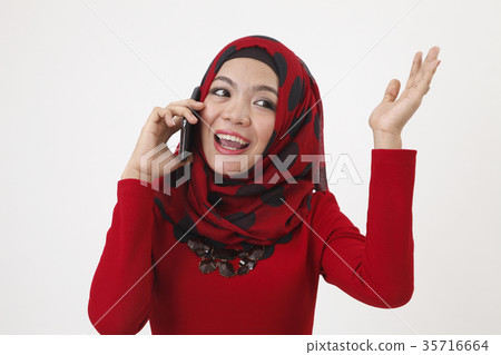 malay woman talking with smart phone 35716664