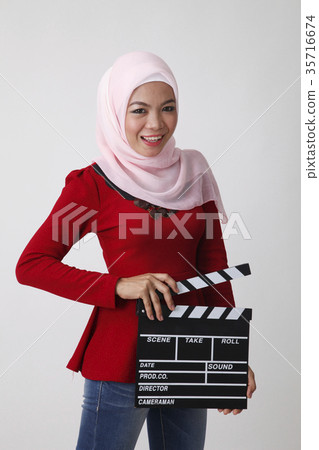 malay woman holding clapper board 35716674