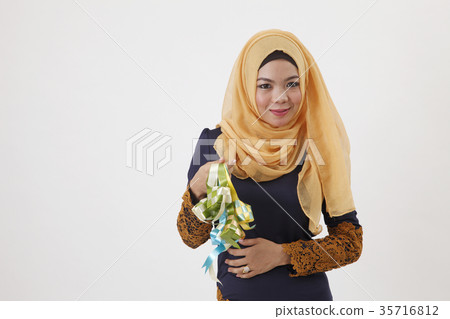 malay woman showing ketupat 35716812