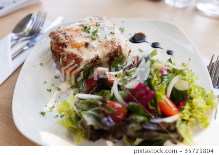Authentic Italian Meat Lasagna with fresh salad 35721804