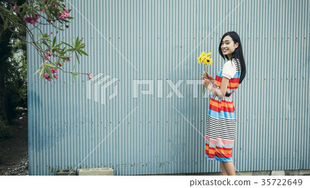 A woman with flowers A woman with flowers 35722649