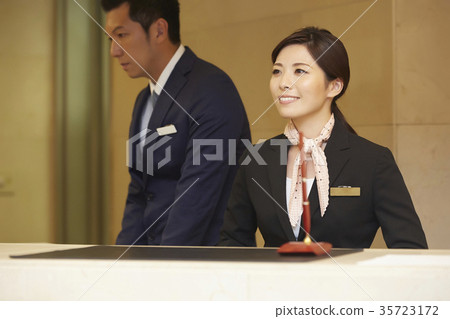 Men and women working in a hotel reception Men and women working in a hotel reception 35723172