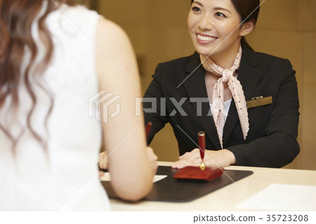 Woman working in a hotel reception 35723208