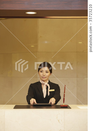 Woman working in a hotel reception 35723210