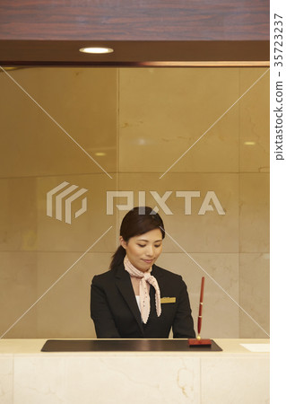 Woman working in a hotel reception 35723237