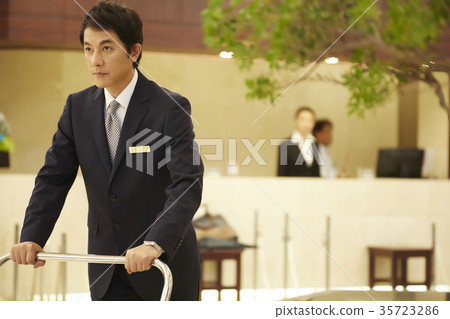 Men working at a hotel 35723286