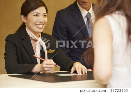 Woman working in a hotel reception 35723303