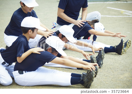 Boy baseball practice stretch preparation Boy baseball practice stretch preparation 35723664