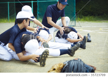 Boy baseball practice stretch preparation 35723709