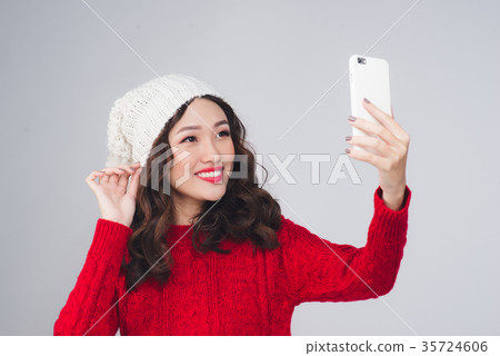 Happy young asian woman wearing winter clothing 35724606