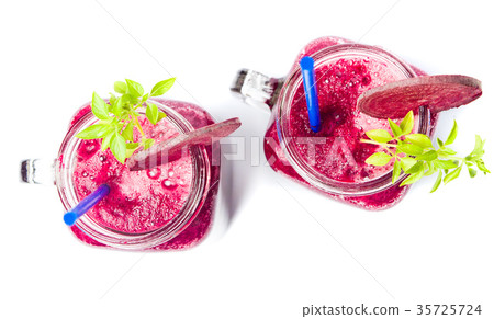 Healthy beet smoothie in a jar isolated Healthy beet smoothie in a jar isolated 35725724