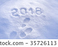 New Year 2018 greeting, footprints in snow 35726113