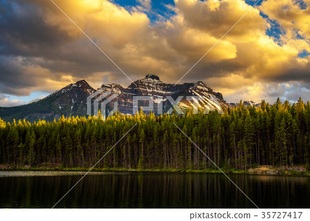 Sunset over deep forest along the Herbert Lake in 35727417