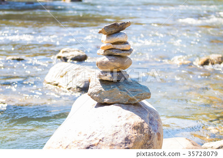 Balanced stone pyramid blue water  Mountain River. 35728079