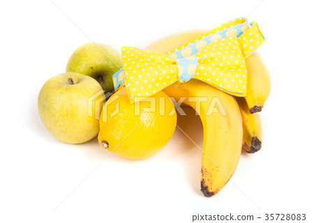 Composition, a yellow bow tie lies on the bananas Composition, a yellow bow tie lies on the bananas 35728083