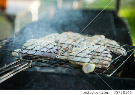 Roast chicken on grill. Fried chicken on the 35728146