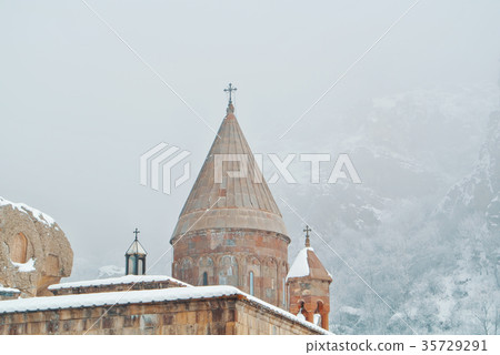 A dome of armenian monastery Geghard, trees A dome of armenian monastery Geghard, trees 35729291