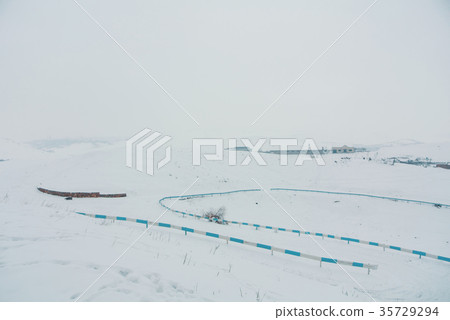 A dangerous serpentine road in the mountains A dangerous serpentine road in the mountains 35729294