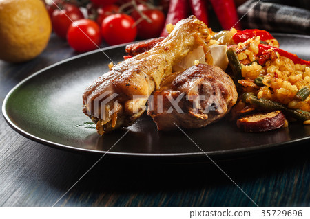 Traditional paella with chicken legs 35729696