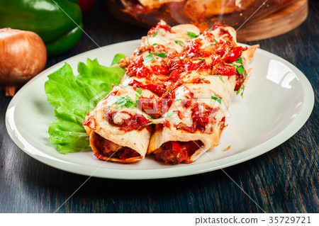 Traditional mexican enchiladas with chicken meat 35729721