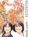 Autumn leaves and twin sisters 35729750