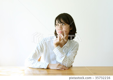 A woman indulging in thought 35732216