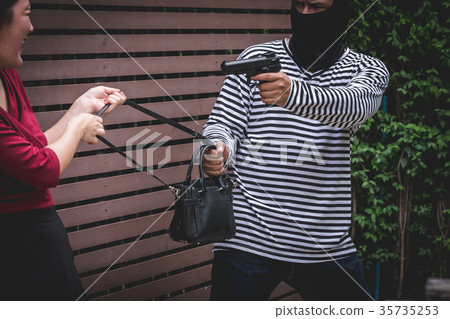 young woman fight over with robber  35735253