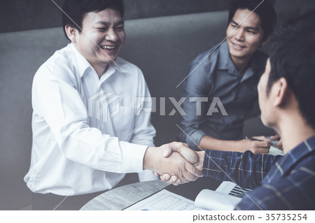 business partners handshaking business partners handshaking 35735254