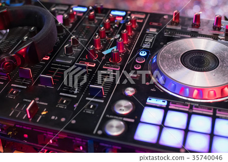 DJ is rhythm music with Controller and mixer. 35740046