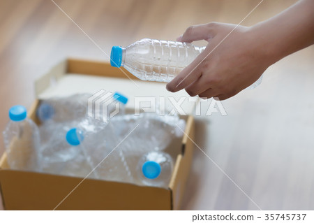 man hand putting plastic reuse for recycling n man hand putting plastic reuse for recycling n 35745737