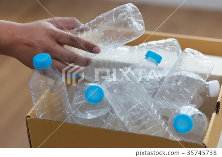 man hand putting plastic reuse for recycling man hand putting plastic reuse for recycling 35745738