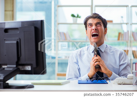Angry businessman with gun thinking of committing 35746207