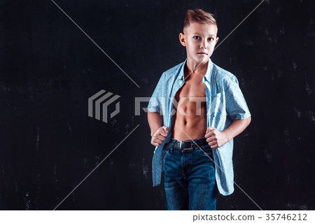 Boy in shirt posing for camera 35746212