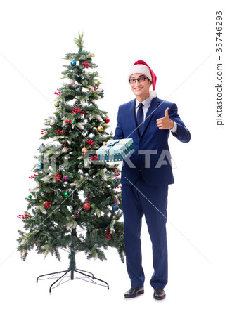 Businessman decorating christmas tree isolated on 35746293