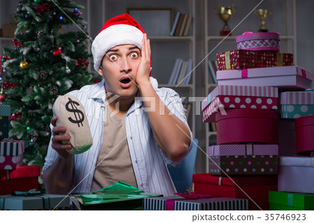 Man with many christmas gifts in boxes 35746923