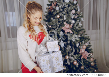 loving couple decorating Christmas tree loving couple decorating Christmas tree 35748886