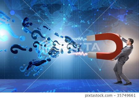 Businessman catching questions on horseshoe magnet Businessman catching questions on horseshoe magnet 35749661
