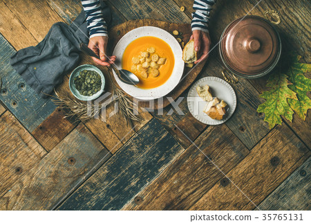 Fall warming pumpkin cream soup, copy space 35765131