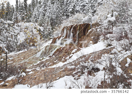 Waterfalls in the winter, huanglong valley, china Waterfalls in the winter, huanglong valley, china 35766142