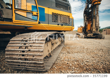 Details of excavator tracks on construction site 35771199