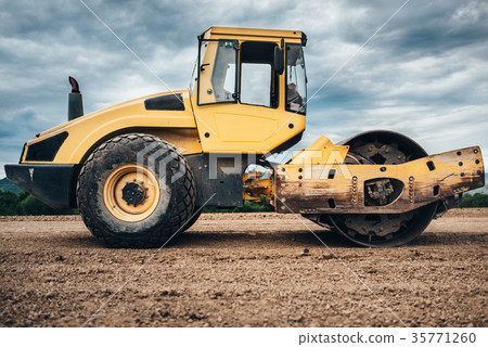 Soil Compactor working during highway construction 35771260