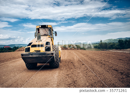 Vibratory Soil Compactor during highway building Vibratory Soil Compactor during highway building 35771261