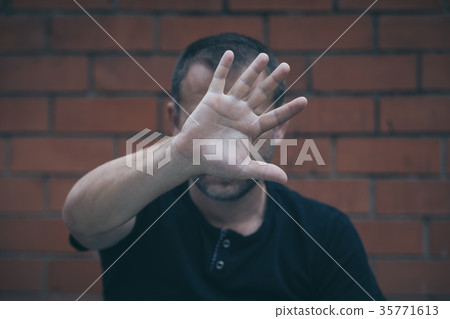 portrait one sad man standing near a wall portrait one sad man standing near a wall 35771613