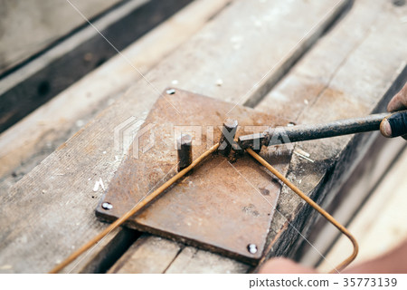 worker hands using steel wire and pincers worker hands using steel wire and pincers 35773139