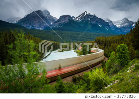Train passing through Morant's Curve in Bow Valley Train passing through Morant's Curve in Bow Valley 35773826
