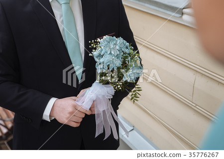 Young handsome groom waiting for his future wife Young handsome groom waiting for his future wife 35776267