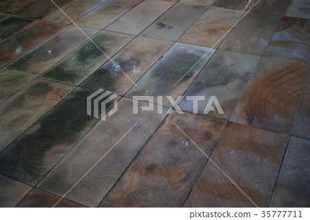 Stone-paved footpath wet with rain Stone-paved footpath wet with rain 35777711
