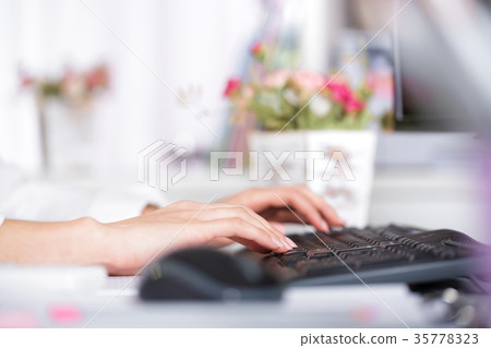 hands typing on laptop's keyboard. hands typing on laptop's keyboard. 35778323